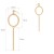Złote kolczyki wiszące z okrągłym elementem i pionową pałeczką na jasnym tle wymiary