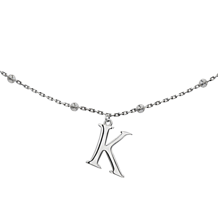 srebrny naszyjnik z literą K na łańcuszku z kuleczkami