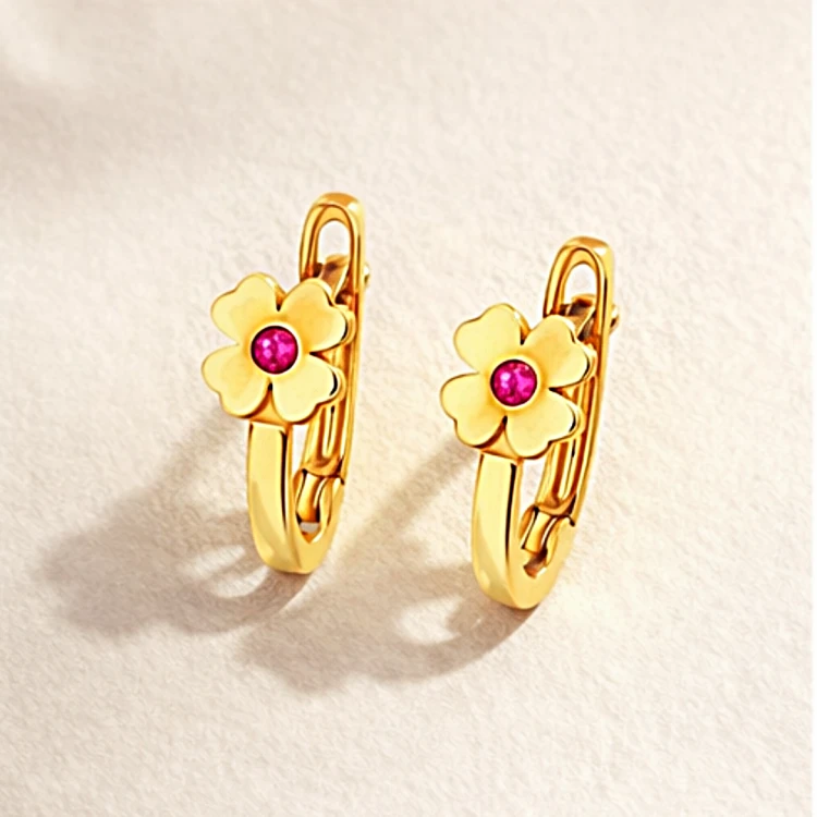 Para złotych kolczyków kół z kwiatkiem i różowym kamieniem