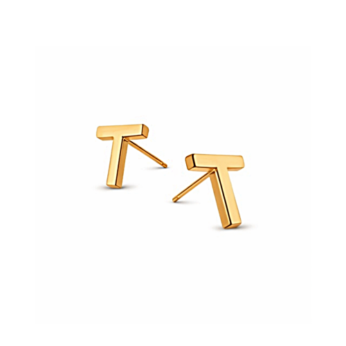 Złote kolczyki sztyfty w kształcie litery T na białym tle